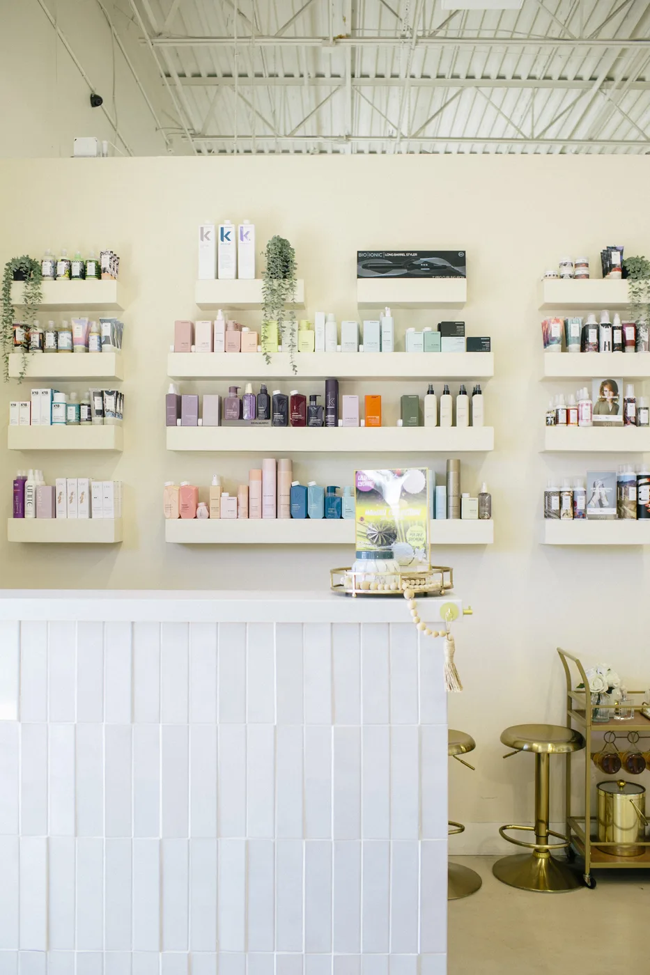 The retail wall and reception inside Bloom Studios in Sandy, Utah